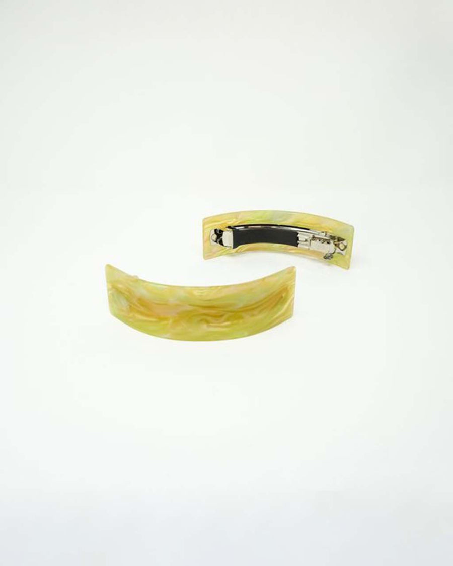 front and back of yellow swirl acrylic pony clip
