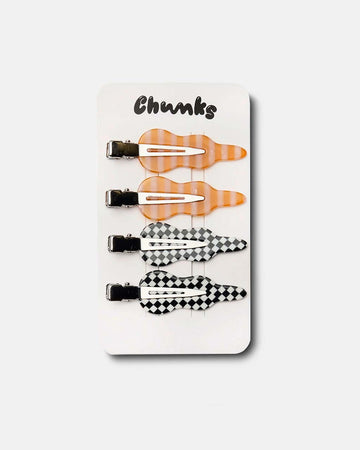set of four squiggle setting clips: orange and pink stripe and black and white checkered