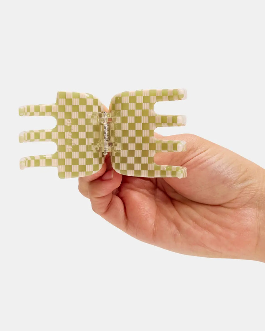 opened green and white checkered hair claw