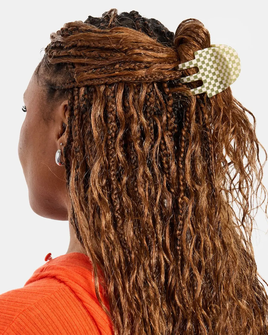 model wearing green and white checkered hair claw