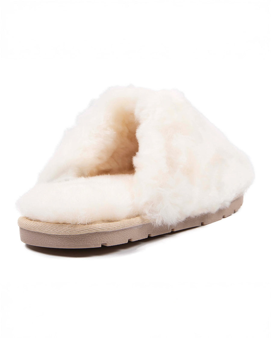 back view of white sheepskin fuzzy slip-on slipper with rubber sole