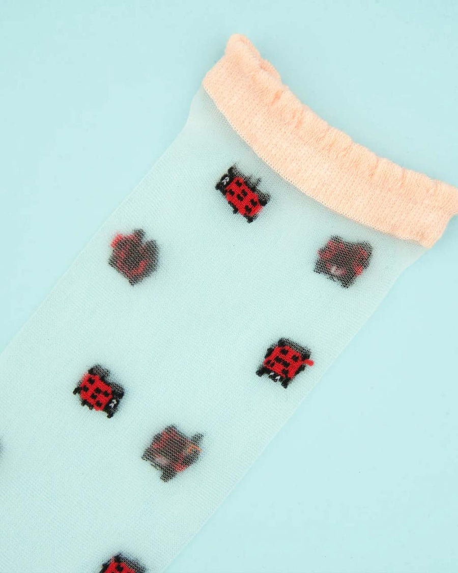 sheer socks with dainty lady bug print and cream trim