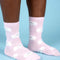 model wearing pink socks with all over white persian cat print