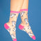 model wearing sheer socks with all over poodle print and pink trim