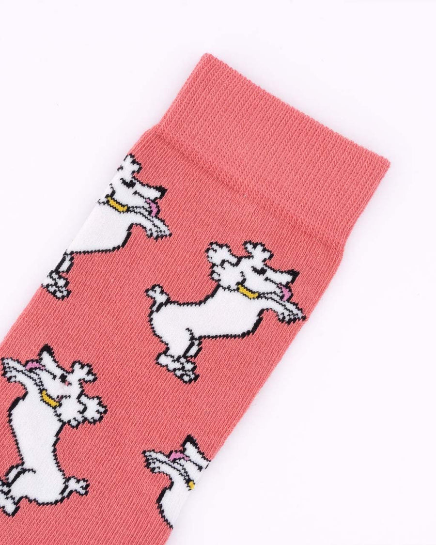 up close of pink socks with white poodle print