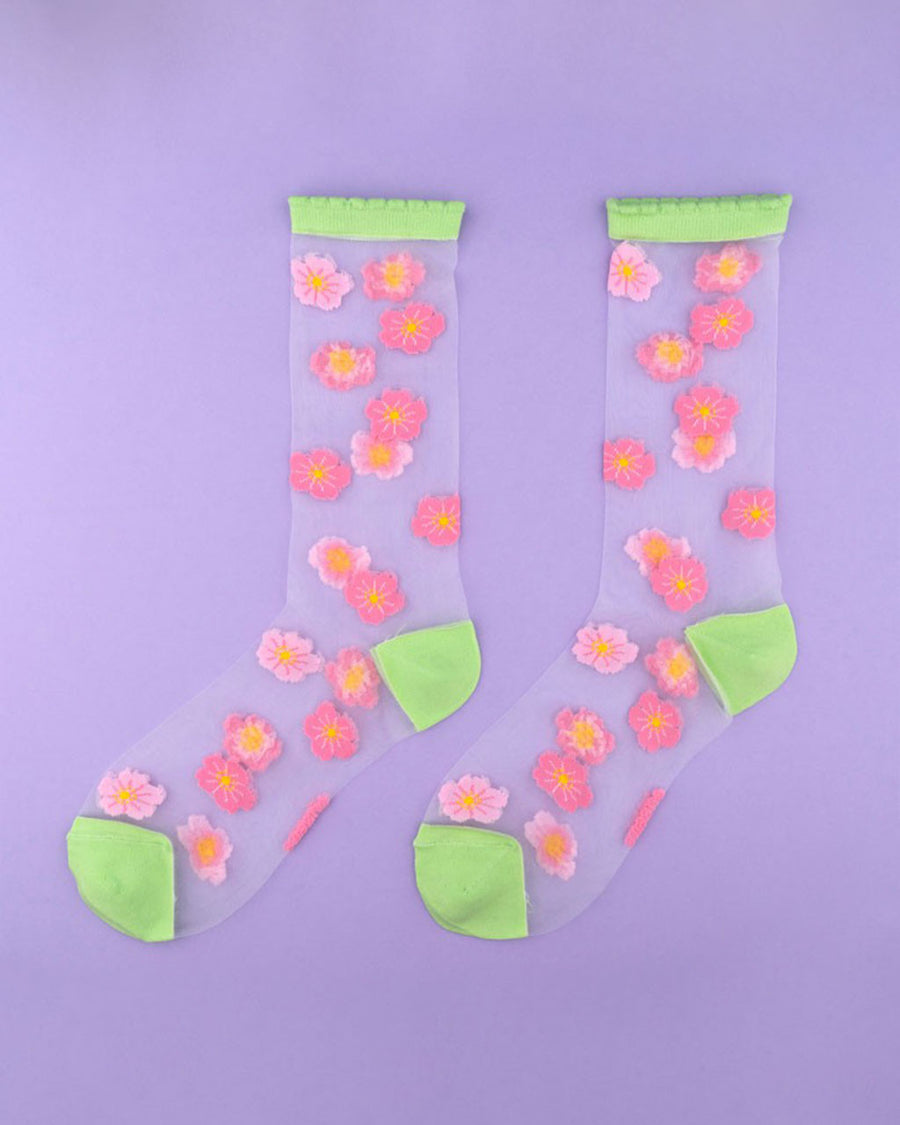 sheer socks with dark and light pink all over flower design with lime green trim
