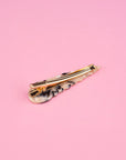 alligator clip on tan and black seashell hair clip