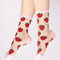 model wearing sheer socks with all over strawberry print and pink trim