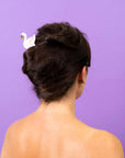 model wearing swan shaped hair stick