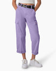 model wearing lavender cropped cargo pants with black 'dickies' belt