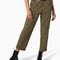 model wearing dark olive green cargo pants with green contrast stitching and black dickies belt