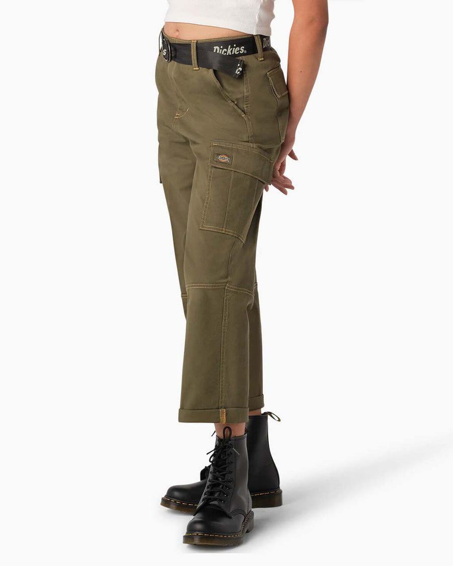 side view of model wearing dark olive green cargo pants with green contrast stitching and black dickies belt