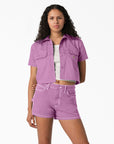 model wearing purple cropped button down work shirt with front patch pockets and dickies patch on bust