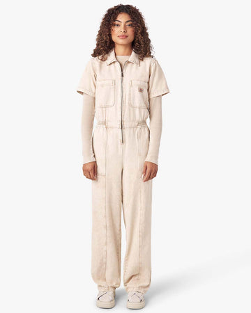 model wearing acid wash stone coveralls with zipper front, short sleeves, patch front pockets and front seam down the legs