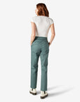 back view of model wearing green dickies work pants