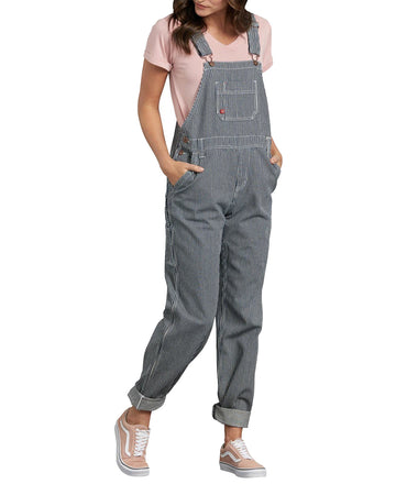 model wearing grey and white pinstripe overalls