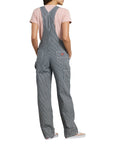 backview of model wearing grey and white pinstripe overalls