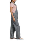 sideview of model wearing grey and white pinstripe overalls
