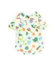 front view  of mint colored button down shirt with monstera leaf, bananas, pineapple, guitar and maracas print 