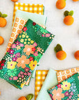 set of 8 cloth napkins in green floral, orange floral, mint seersucker and yellow gingham