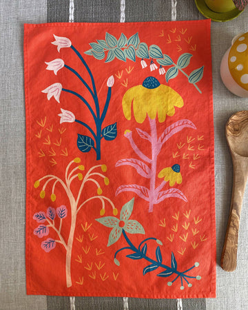 red tea towel with abstract wildflower print