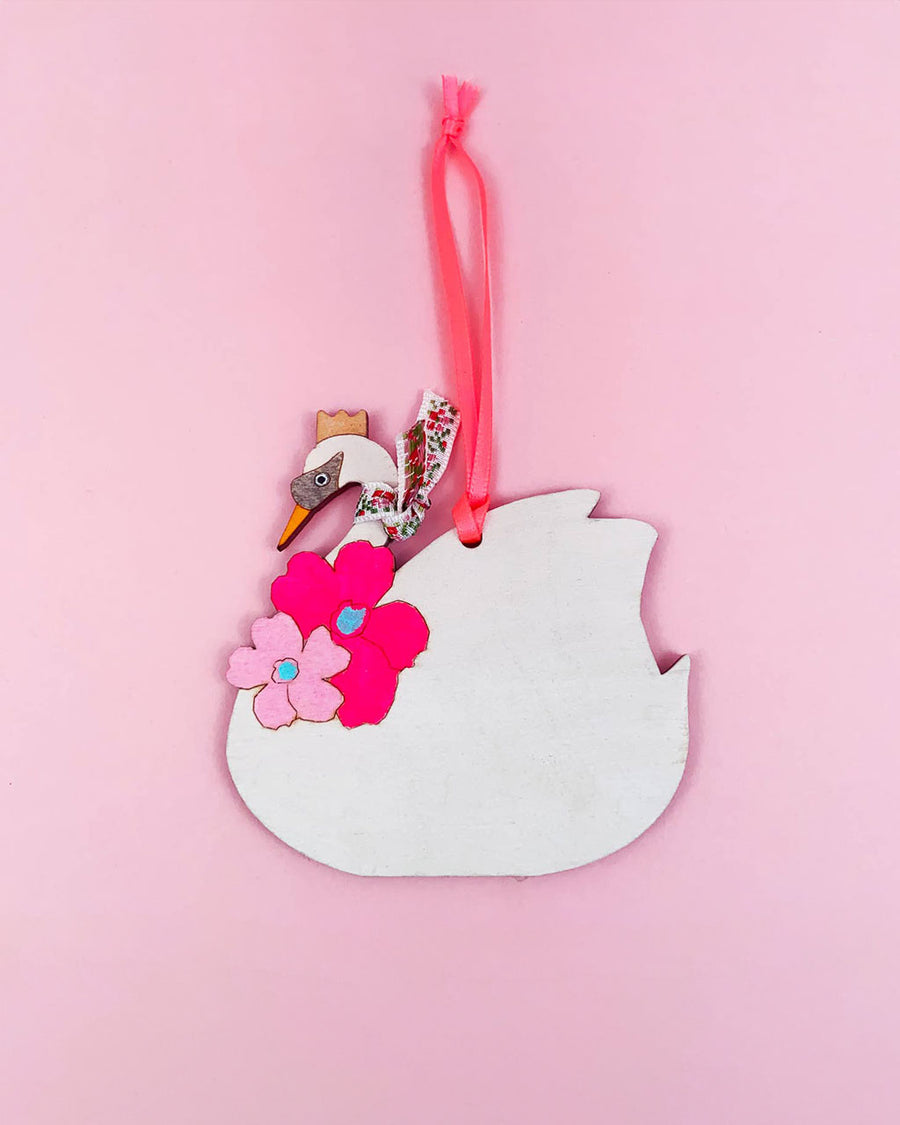 white swan wearing an ascot and hot pink flower wooden ornament