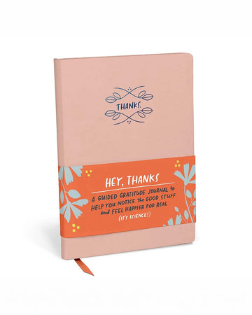 pink gratitude journal with navy 'thanks' graphic on the cover