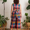 back view of model wearing colorful plaid cropped leg jumpsuit with tie waist