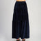 back view of model wearing navy velour midi tiered skirt  and matching tank