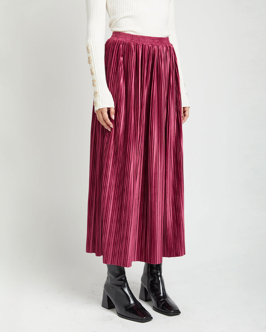 side view of model wearing mulberry silky pleated midi skirt