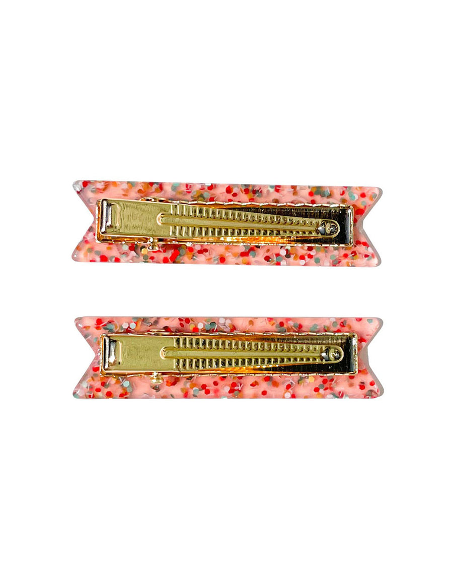 gold alligator clips on pink glittery hair clips with white 'happy' and 'birthday' on them