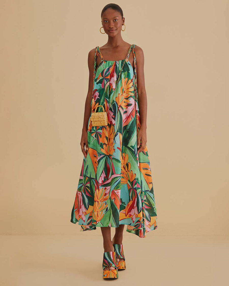 model wearing green abstract print midi sundress with kerchief hem and tie shoulder straps