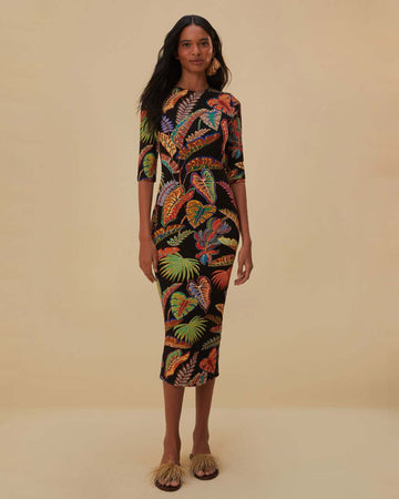 model wearing black midi dress with quarter length sleeves and vibrant foliage print