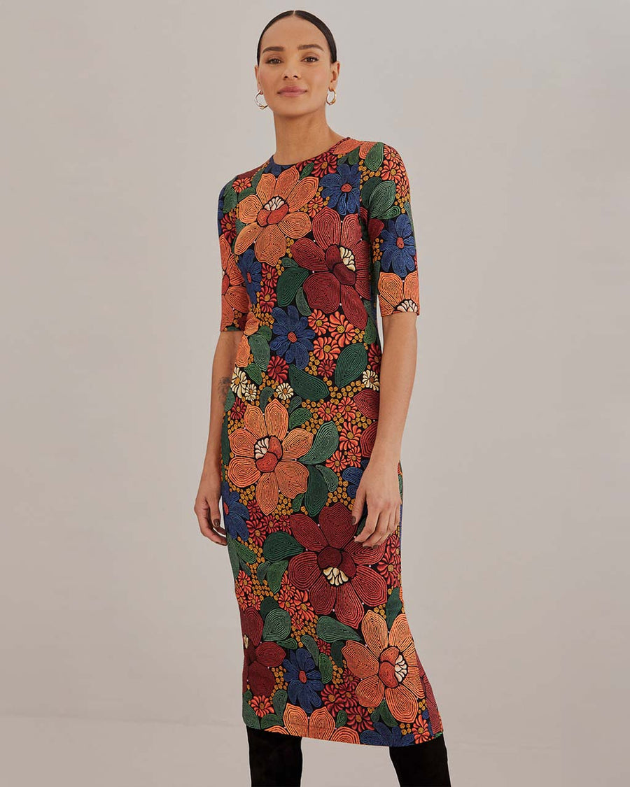 model wearing colorful stitched floral bodycon midi dress with short sleeves