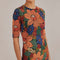 up close of model wearing colorful stitched floral bodycon midi dress with short sleeves