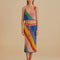 model wearing open crochet midi skirt with diagonal multicolor stripes and pink drawstring and matching cropped tank