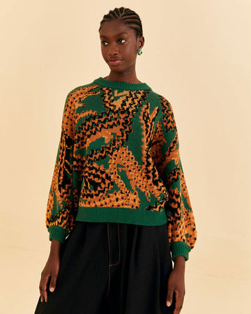 model wearing green sweater with yellow and orange croc print