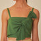 up close of model wearing green cropped tank with oversized bow detail on the bust