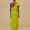 back view of model wearing lime green maxi dress with tie waist and one shoulder 'leaf' detail with pleats