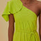 up close of model wearing lime green maxi dress with tie waist and one shoulder 'leaf' detail with pleats