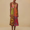 model wearing colorful patchwork midi dress with button front and keyhole opening at the bust