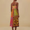 back view of model wearing colorful patchwork midi dress with button front and keyhole opening at the bust