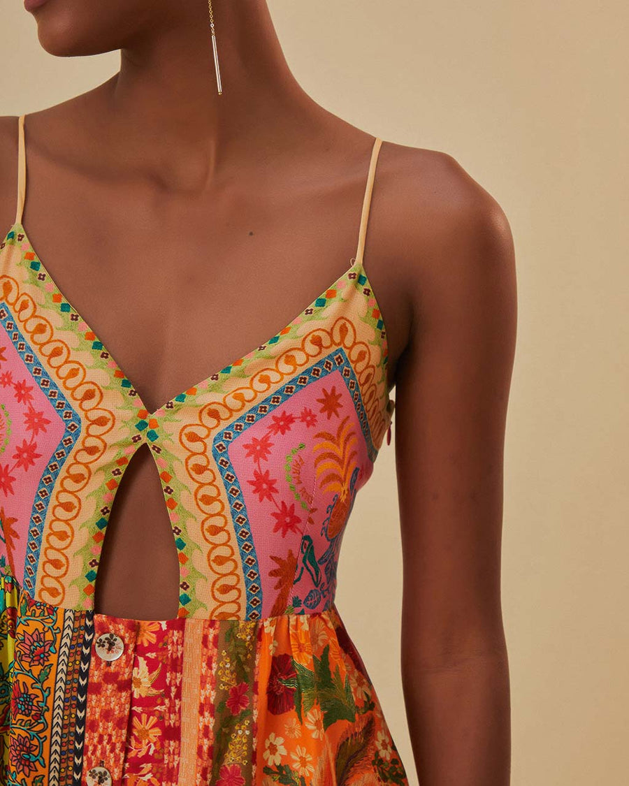 up close of model wearing colorful patchwork midi dress with button front and keyhole opening at the bust
