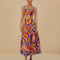 model wearing colorful midi skirt with wavy hems and periwinkle trim
