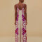 back view of model wearing cream jumpsuit with purple and red oversized floral print and rope straps