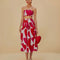 model wearing white midi skirt with painted red and pink hearts and smocked waistband