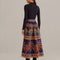 back view of model wearing purple midi skirt with pops of teal, brown and orange abstract print