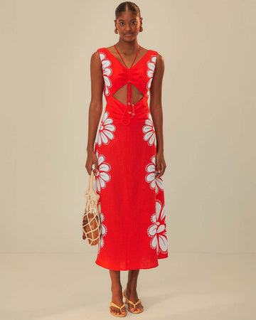 model wearing red midi dress with white flowers on the sides and beaded cinched tie bodice
