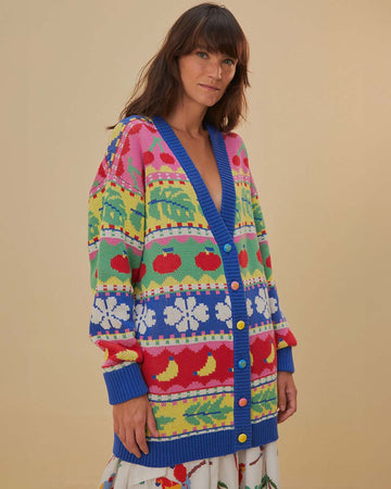 model wearing oversized fruit and leaf stripe cardigan with colorful pastel button front