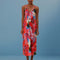 model wearing vibrant pink floral midi length cover up with rope straps and tie waist